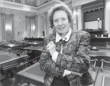  ?? Rich Pedroncell­i Associated Press ?? ‘LADYLIKE, GRACIOUS AND TOUGH AS NAILS’ From her work at the CIA and the U.N. to her support of San Diego’s downtown redevelopm­ent, Killea, shown in the state Senate chamber in 1982, forged her own path in a political world dominated by men.