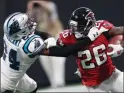  ??  ?? Falcons running back Tevin Coleman runs against Panthers cornerback James Bradberry during a game in Atlanta on Sunday.