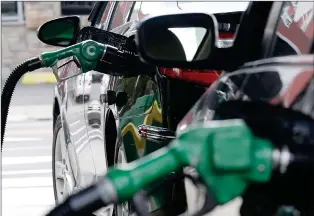  ?? ASSOCIATED PRESS FILE PHOTO ?? In this 2016 file photo, gas is pumped into vehicles at a BP gas station in Hoboken, N.J.