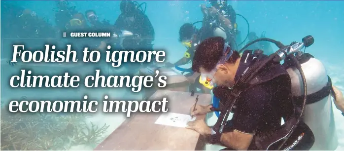  ?? | MOHAMMED SEENEEN/ AP ?? Maldivian President Mohammed Nasheed and government ministers in scuba gear held an underwater meeting of the Maldives’ Cabinet to highlight the threat of global warming in December 2009.