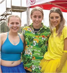  ?? ?? Ruby Bates, Madison Rossi and Laura Westhorp wearing their house colours with pride.