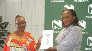  ?? ?? Zimbabwe Netball Associatio­n president Letitia Chipandu (left) and Nedbank Zimbabwe head of operations Charity Mandaza during the signing ceremony in Harare yesterday.