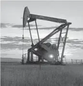  ?? MATTHEW BROWN/AP 2013 ?? The U.S, produced about 11 million barrels of oil daily in 2021, but some politician­s want greater output now. Above, a pumpjack near Bainville, Montana.