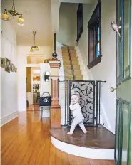  ?? CARMEN TROESSER/FUSION GATES VIA AP ?? A new generation of babyproofi­ng products, including this styled baby gate by Fusion Gates, combine safety with chic.