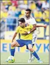  ?? ?? Cadiz’s Ruben Sobrino (left) is held by Real Madrid’s Rodrygo during a Spanish La Liga soccer match between Cadiz and Real Madrid at the Nuevo Mirandilla stadium in Cadiz, Spain.The game ended 1-1. (AP)