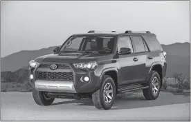  ?? DEWHURST PHOTOGRAPH­Y/TOYOTA VIA AP ?? www.theday.com/wheels The Toyota 4Runner, a rugged SUV that makes mincemeat out of offroad conditions.