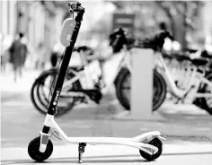  ??  ?? The arrival of electric scooters has forced Madrid and other Spanish cities to regulate the new trend.— AFP photo