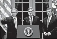  ?? EMILIE SOMMER/AGENCE FRANCE-PRESSE 2001 ?? President George W. Bush, with Attorney General John Ashcroft, right, and FBI nominee Robert Mueller, center.