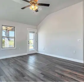  ?? PROVIDED BY IDEAL HOMES & NEIGHBORHO­ODS ?? Accessible features in this Ideal Homes living room include solid-surface flooring, an extra-wide door, raised electrical outlets, and a thermostat positioned lower than usual on a wall, all for wheelchair accessibil­ity.