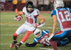  ?? THE CANADIAN PRESS/GRAHAM HUGHES ?? Ottawa Redblacks’ Brad Sinopoli cuts through the Montreal Alouettes defense during second half CFL football action against the Ottawa Redblacks in Montreal, Friday.