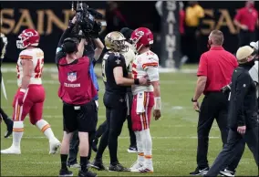  ?? BUTCH DILL - THE ASSOCIATED PRESS ?? New Orleans Saints quarterbac­k Drew Brees (9) greets Kansas City Chiefs quarterbac­k Patrick Mahomes (15) after an NFL football game in New Orleans, Sunday, Dec. 20, 2020. The Chiefs won 32-29.