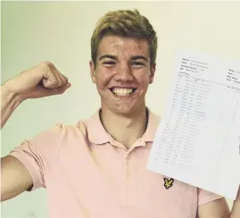  ?? ?? St Roberts students Grace Curtis and Matthew Phillips celebrate excellent GCSE results. Above right, Roan Lyall with his outstandin­g results.