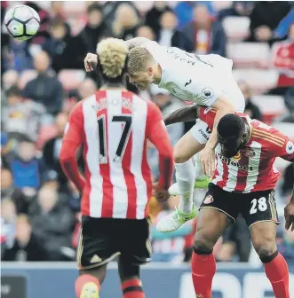  ??  ?? Swansea defender Alfie Mawson gets the better of Victor Anichebe. Picture by Frank Reid.