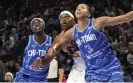  ?? ?? Chicago’s Candace Parker, right, and Kahleah Copper, left, block out Connecticu­t’s Jonquel Jones during the first half of Thursday night’s game. Photograph: Charles Rex Arbogast/AP