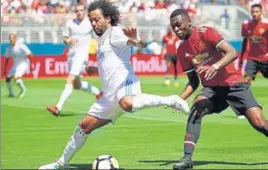  ?? AFP ?? Real Madrid’s Marcelo Da Silva (L) and Manchester United’s Timothy FosuMensah vie for the ball during their Internatio­nal Champions Cup match at Levi's Stadium in Santa Clara on Sunday.