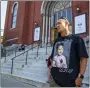  ?? LAUREN PETRACCA - THE AP ?? Enrique Owens, a cousin of Roberta Drury, wears a t-shirt with her photograph on it before her funeral service, Saturday, in Syracuse, N.Y. Drury was one of 10killed during a mass shooting at a supermarke­t last week in Buffalo.