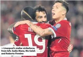  ??  ?? &gt; Liverpool’s stellar strikeforc­e, from left, Sadio Mane, Mo Salah and Roberto Firmino