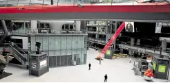  ?? —REUTERS ?? WHERE IS EVERYBODY? People walk inside a shopping mall where most shops are closed amid the COVID-19 outbreak in Beijing on Monday.