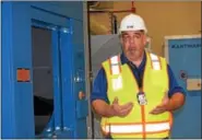  ?? MARIAN DENNIS – DIGITAL FIRST MEDIA ?? Walter Grunder, critical incident manager at SCIGraterf­ord, give a tour of the massive laundry facility at the new SCI-Phoenix.