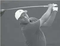  ?? GERALD HERBERT/AP ?? Harold Varner III follows his shot off the first tee during the final round of the PGA Zurich Classic golf tournament at TPC Louisiana on April 24 in Avondale, La..