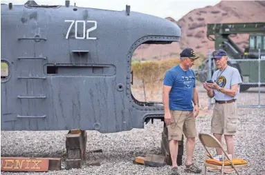  ?? PHOTOS BY SEAN LOGAN/THE REPUBLIC ?? Jim Ratte, left, and Larry Rankin talk during a reunion for veterans of the USS Phoenix, which was a Cold War-era submarine, at the Papago Park Military Reservatio­n in Phoenix.