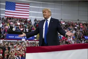  ?? EVAN VUCCI ?? In this Jan. 14, 2020, photo, President Donald Trump arrives at UW-Milwaukee Panther Arena to speak at a campaign rally in Milwaukee. Trump’s surrogates are fanning out across the country as part of an aggressive effort to stretch his appeal beyond the base of working-class white voters who propelled him to victory in 2016