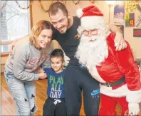  ?? .*5$) ."$%0/"-% 5)& (6"3%*"/ ?? Eugena Cani, left, four-year-old Keidi Cani and Skerdi Cani were overjoyed to receive a surprise visit from Santa on Christmas morning this year. The P.E.I. charity, Santa’s Angels, visited the family as one of several unschedule­d stops near the end of...