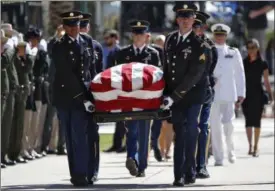  ?? MATT YORK — THE ASSOCIATED PRESS ?? Military personal carry the casket of Sen. John McCain, R-Ariz., into the Capitol rotunda for a memorial service, Wednesday at the Capitol in Phoenix.