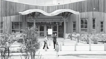  ?? MARK LENNIHAN/AP ?? The new Sandy Hook Elementary, built to replace the site of a 2012 mass shooting, opened this week.