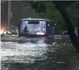  ?? —S.SURENDERRE­DDY ?? An RTC bus wades through a flooded RP Road in Secunderab­ad after heavy rains lashed the city again on Saturday.