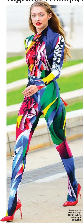  ??  ?? Rainbow of colours: Gigi Hadid in her skin-tight bodysuit