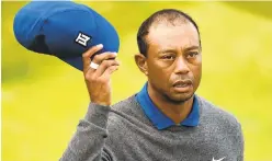  ?? GETTY ?? Tiger Woods reacts after finishing at 7-over par in the first round of the British Open at Royal Portrush in Northern Ireland.