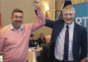  ?? Pic: ?? Sinn Féin councillor Thomas Healy congratula­tes party colleague, Martin Kenny on his re-election to the Dáil. Carl Brennan.
