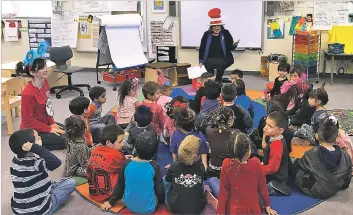  ?? ROBERT NOTT/THE NEW MEXICAN ?? Santa Fe Public Schools Superinten­dent Veronica García reads to a group of pre-K students Thursday at the Nye Early Childhood Center. The district has about 370 children enrolled in pre-K programs, but only 140 are in full-day pre-K programs because of...