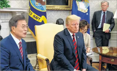  ?? AP PHOTO ?? National Security Adviser John Bolton listens during a meeting between President Donald Trump and South Korean President Moon Jae-In in the Oval Office of the White House Tuesday in Washington.