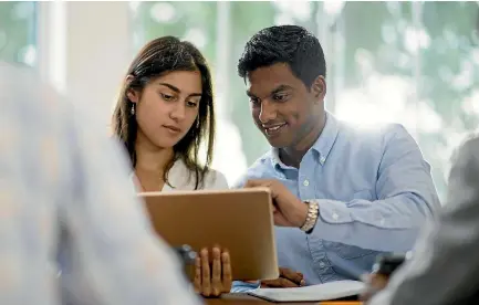  ??  ?? Two applicants prepare to try out Fluent IQ’s test, aimed at eliminatin­g bias in job recruitmen­t.