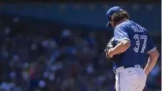  ?? CHRIS YOUNG/THE CANADIAN PRESS ?? The Jays’ Jason Grilli had an eighth inning to forget on Saturday as the Yankees torched him for four homers en route to a 7-0 victory.