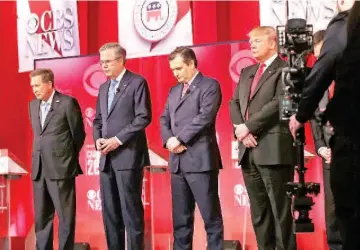  ??  ?? (From left) Kasich, Bush, Cruz and Trump observe a moment of silence for US Supreme Court Justice Antonin Scalia, who passed away on Saturday, during a CBS News GOP Debate at the Peace Center in Greenville, South Carolina. — AFP photo