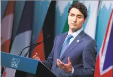  ?? Lars Hagberg / AFP / Getty Images ?? Canadian Prime Minister Justin Trudeau took issue with President Trump threatenin­g to impose new tariffs.