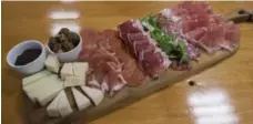  ??  ?? A board of artisanal cured meats, a Speducci Mercatto house specialty.