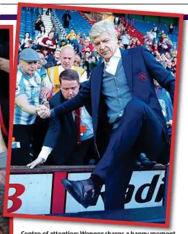  ?? GETTY IMAGES ?? Centre of attention: Wenger shares a happy moment with Arsenal fans (left) and a Huddersfie­ld supporter shakes his hand as he departs the stage