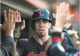  ?? Thearon W. Henderson / Getty Images ?? Bradley Zimmer is congratula­ted after scoring against the Giants in the fifth inning.