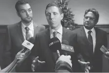  ?? DAN JANISSE ?? Ontario Progressiv­e Conservati­ve Leader Patrick Brown, centre, speaks to reporters at the Windsor-Essex Regional Chamber of Commerce meeting Thursday at the Caboto Club as local PC candidates Adam Ibrahim, left, and Mohammad Latif look on.