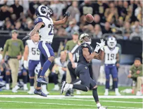  ?? CHUCK COOK/USA TODAY SPORTS ?? Saints receiver Michael Thomas hauls in a touchdown catch that went over the head of Rams cornerback Marcus Peters (22) in Week 9. Thomas amassed 211 yards receiving in the Saints’ 45-35 win.