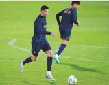  ?? AP ?? Cristiano Ronaldo runs with the ball during training in Oeiras, outside Lisbon, Monday.