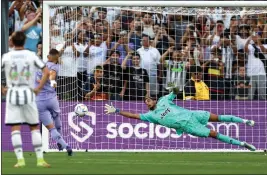 ?? PHOTO BY RAUL ROMERO JR, ?? Real Madrid’s Karim Benzema takes a penalty kick and scores against Juventus goalie Perin Mattia during the first half of the Soccer Champions Tour match at the Rose Bowl.