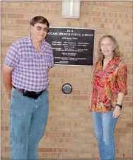  ?? Marc Hayot/Herald Leader ?? Rod (left) and Dolores Deuel pose in front of the plaque for the Siloam Springs Public Library.