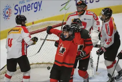  ?? PHOTOS BY SCOTT GARDNER, THE HAMILTON SPECTATOR ?? Team Canada’s Tyler Steenburge­n celebrates his first-period goal against Switzerlan­d, at FirstOntar­io before a crowd of 12,562.