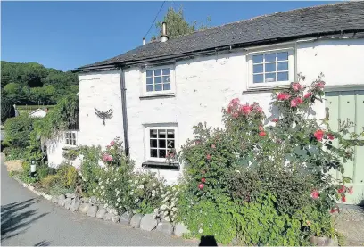  ??  ?? > Rose Cottage, close to Borth and Ynyslas on the west Wales coast