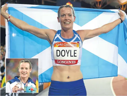  ??  ?? SO PROUD: Eilidh Doyle, of Scotland, celebrates winning silver in the women’s 400 metres hurdles final, her third straight silver at a Games